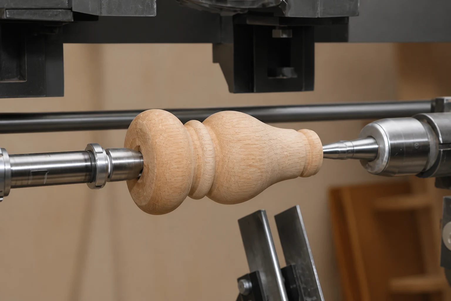 Solid beech furniture component being shaped on a clean, professionally maintained lathe